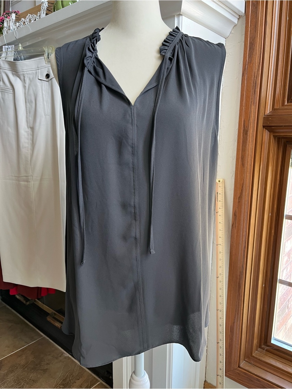 LOFT Charcoal Gray Sleeveless Blouse with Tie Neck and Subtle Ruffle Collar